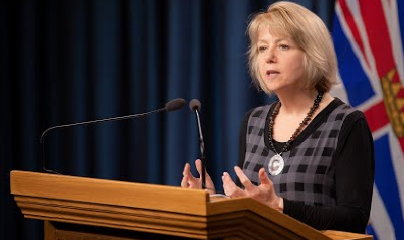 Dr. Bonnie Henry speaking at a podium during a press conference in B.C.