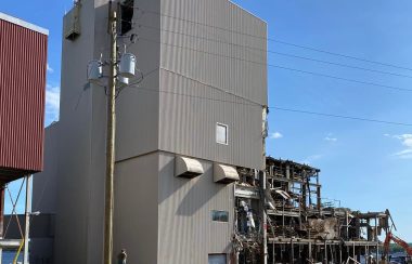 A partially demolished large industrial building