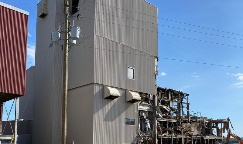 A partially demolished large industrial building