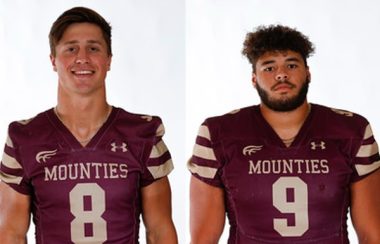 Two young men are pictured wearing dark red football jerseys against a white background.