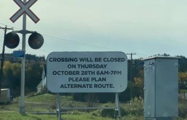 A white sign at a crossing explains a closure on Oct. 28.