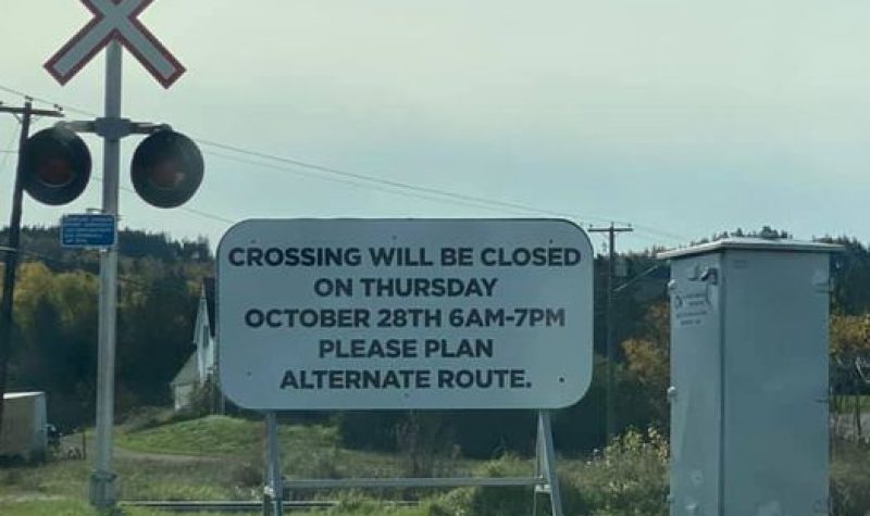 A white sign at a crossing explains a closure on Oct. 28.