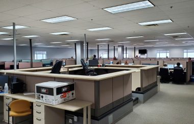 Rows of office cubicles inside a call centre.