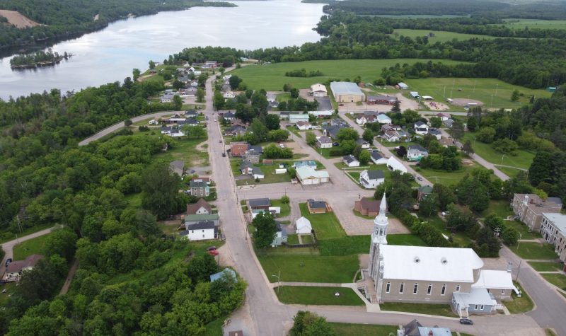 A drone shot of the village of Chapeau.