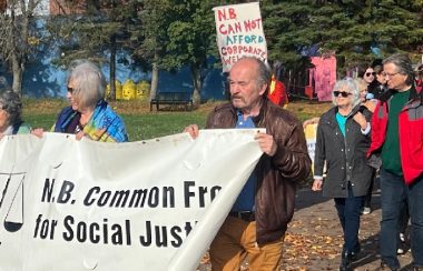 A crowd of approximately 75 people marched through downtown Moncton on Monday, October 17, 2022, to mark the International Day for the Eradication of Poverty. Photo: David Gordon Koch