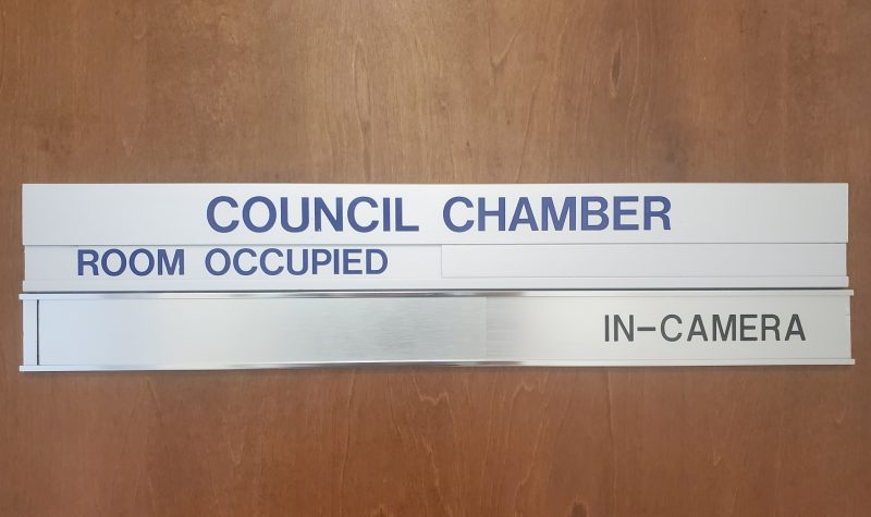 Region of Queens council chamber sign mounted on a door