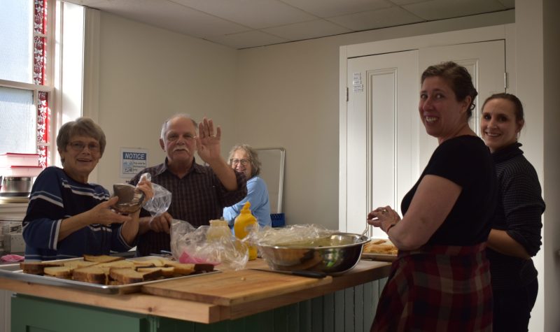 Volunteers at the Main Street Cafe prepare for lunch at their inaugural lunch in November. Photo: contributed