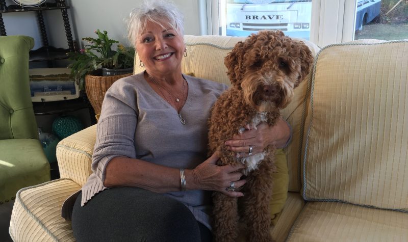 Debbie Wiggins-Colwell at home with her dog Preston. Photo: Erica Butler