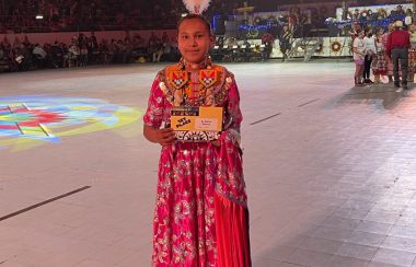 Demi Potts holding First place certificate at Gathering of Nations.