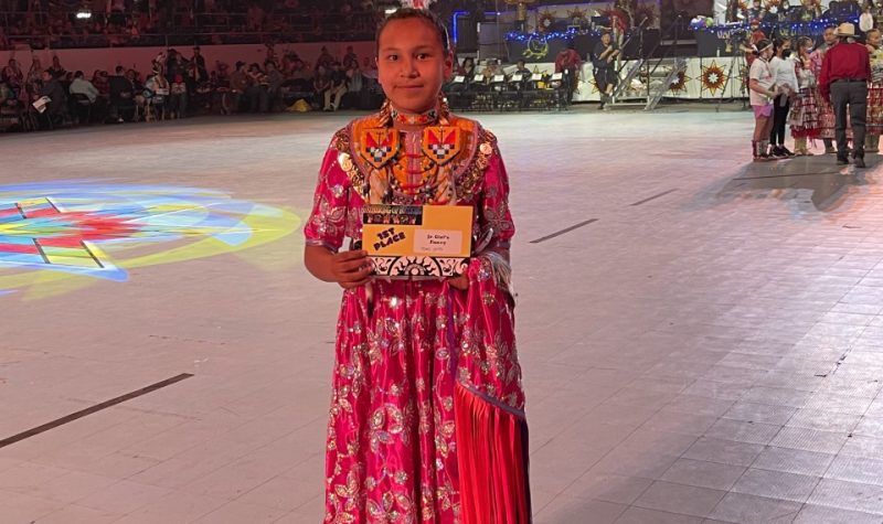 Demi Potts holding First place certificate at Gathering of Nations.