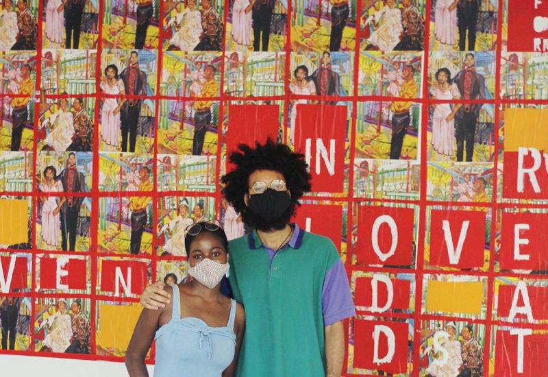 Artist Laurena Fineus is pictured with her cousin in front of her mural in Place d'Orleans shopping centre.