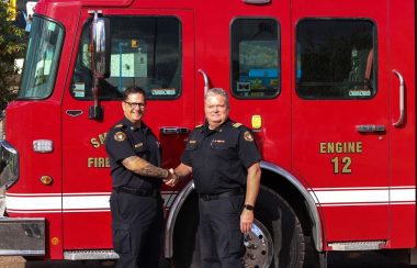 Outgoing Fire Chief Stecko shakes the hand of Deputy Chief Zacharias who will become Chief on December 1, 2021.