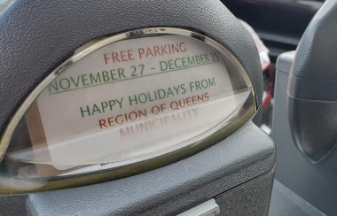 Parking meter displays a free parking sign