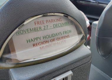 Parking meter displays a free parking sign