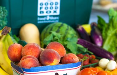 Various fruits in a basket on a table