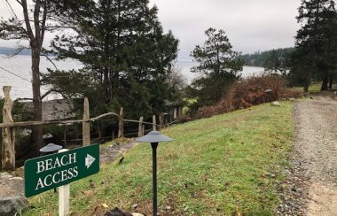 A beach side pathway leads to oceanside gathering places at Cortes Island's Hollyhock Learning and Leadership Centre.