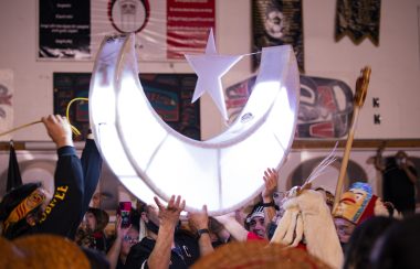 Crescent Moon held up by Nisga'a members