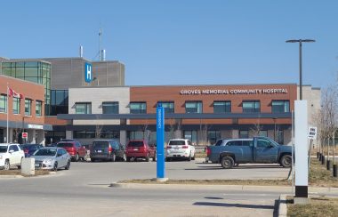A blue sky sits behind the parking lot of Groves Hospital in Fergus, ON.