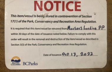 A sticker notice is pictured directing owners to remove their boats from the Mansons Lagoon Provincial Park.