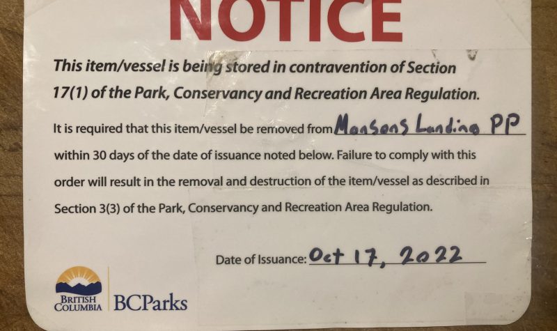 A sticker notice is pictured directing owners to remove their boats from the Mansons Lagoon Provincial Park.