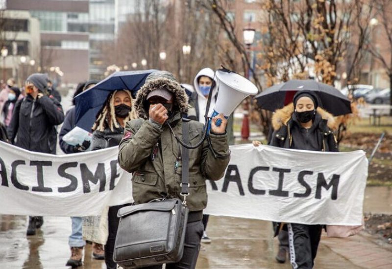 Organizers walking outside near the University of Ottawa prostesting the new anti-racism committee. Photo courtesy of @Uracism.e instagram page.
