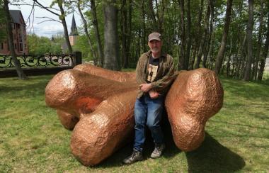 Artist Paul Griffin stands with his work, Elegy for an Elm, which recently appeared on the grounds of Cranewood on Main. Photo: Erica Butler