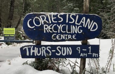 Snow laden sign marks entryway to the Cortes Island waste management centre.