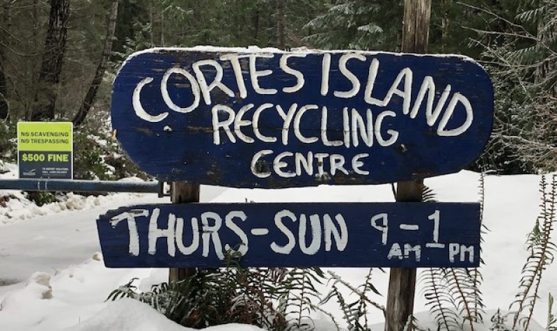 Snow laden sign marks entryway to the Cortes Island waste management centre.