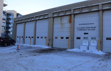 St. Albert Food Bank, from outside the warehouse. Sky is clear, sun starting to set.