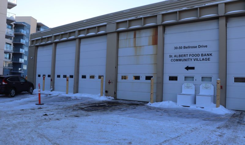 St. Albert Food Bank, from outside the warehouse. Sky is clear, sun starting to set.