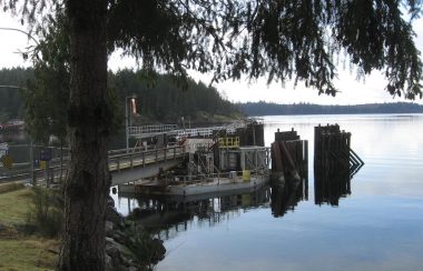 An empty ferry dock, surrounded by still waters