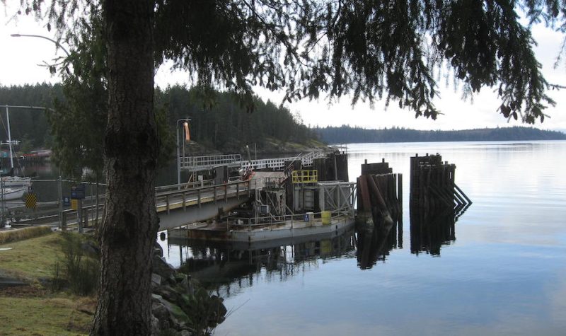 An empty ferry dock, surrounded by still waters