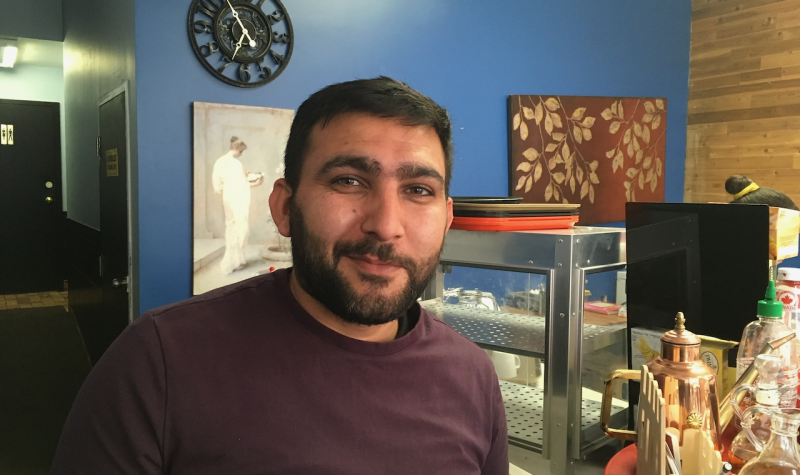 A man standing in a restaurant