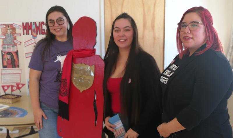 Keeshia Bernard, Katelyn Nash, and Torey Solomon, students in the Mi’kmaq Maliseet Bachelor of Social Work program which meets in Sackville. The group stands with a silhouette of Rowena Mae Sharpe who was killed in 2012. Photo: Erica Butler