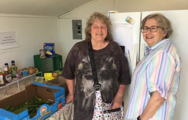 Sackville Food Bank vice-president Tammy Faye and president Heather Patterson stand inside the new Community Sharing Cupboard on Lorne Street, behind the Ice Cream Coop. Photo: Erica Butler