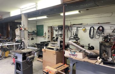 Workshop with power tools and wood working equipment.