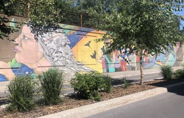 A partial view of a mural showing the history of Pointe-Saint-Charles.