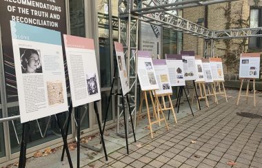 White boards with text displayed outside a building