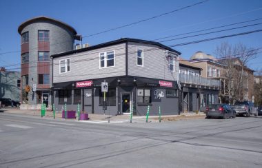 A photo of Boyd's Pharmasave, one of the pharmacies in the HRM offering the testing for three infectious diseases. It is a grey building with Pharmasave in red.