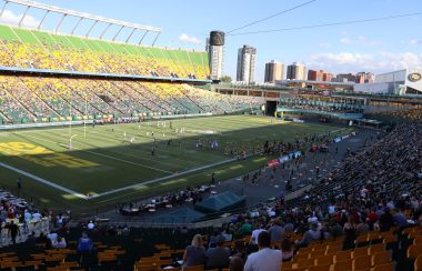 The Commonwealth stadium crowd at the Edmonton Elks Indigenous Celebration game. It is a sunny day and the stadium is full.