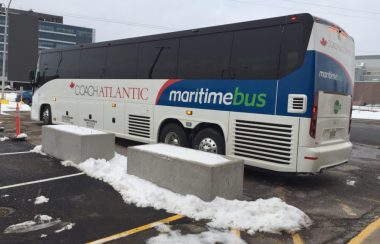 A Maritime Bus coach outside of a bus station.