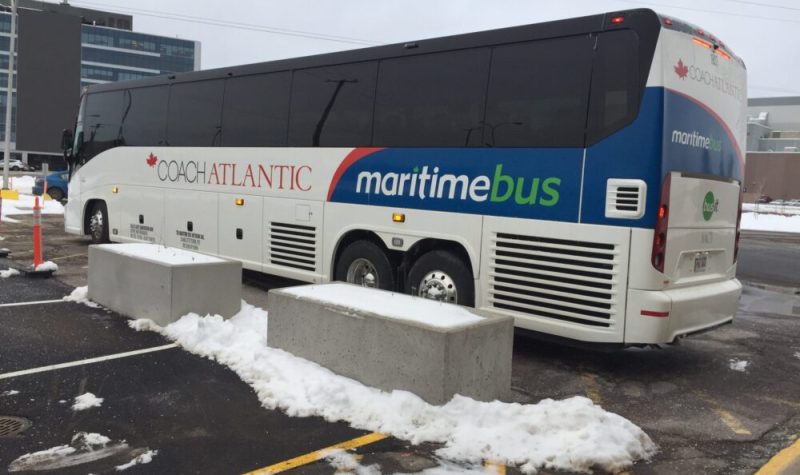 A Maritime Bus coach outside of a bus station.