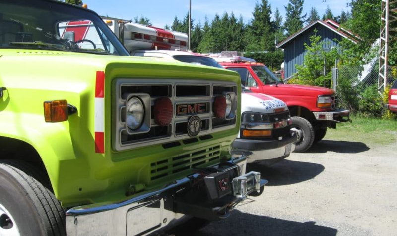 A photo of volunteer fire trucks and an ambulance (from Campbell River) at Cortes Island 2017 Emergency Preparedness & Awareness Weekend.