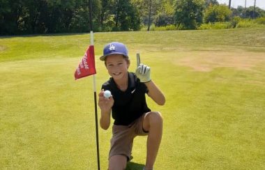 Showing golfer after hole in one shot