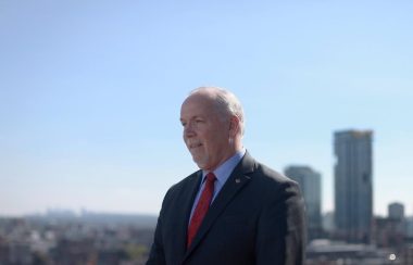A photo of John Horgan outside in Vancouver.
