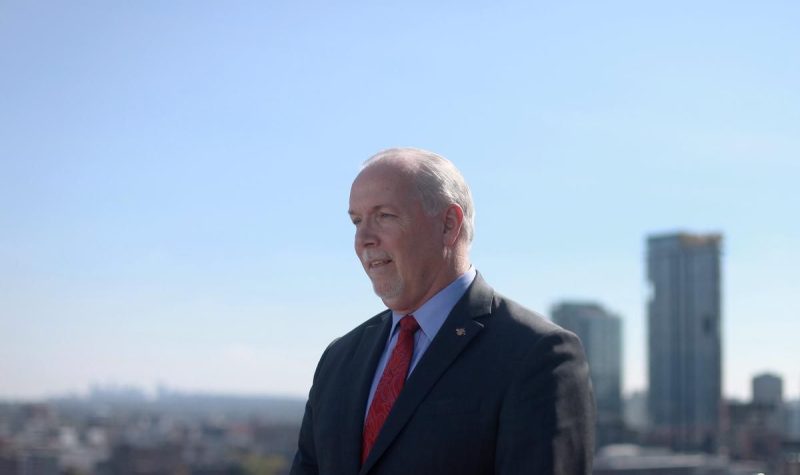 A photo of John Horgan outside in Vancouver.