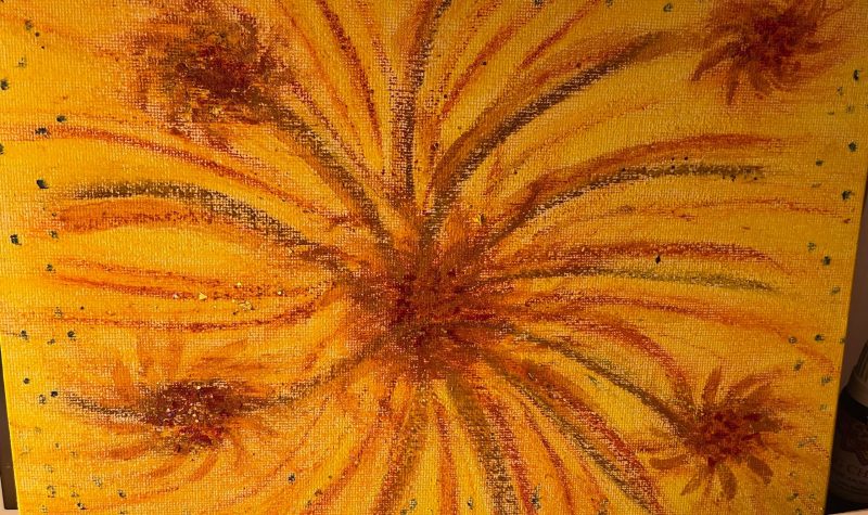 A sunflower painting with bright orange and red colours on an orange background.