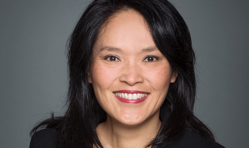 An official parliamentary headshot of Jenny Kwan against a grey backdrop