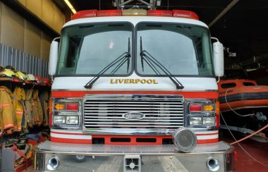 The front of a red Liverpool fire engine.