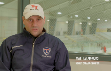 A still of Matt Estabrooks in a hockey rink.